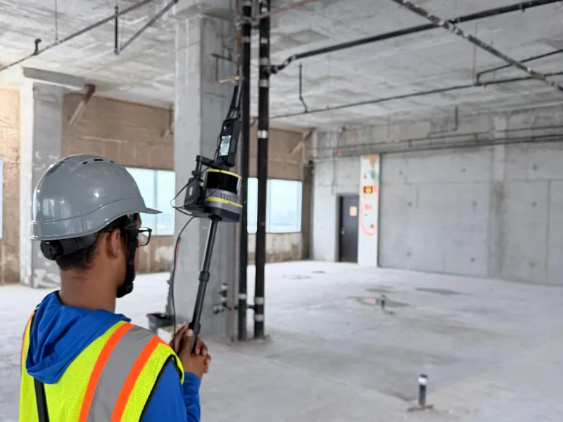 SurveyFy surveyor scanning a building interior with a mobile SLAM LiDAR scanner for an as-built survey