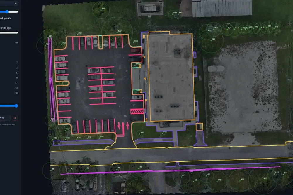 Surveyfy AI workstation showing planimetric linework traced over an aerial point cloud of a parking lot